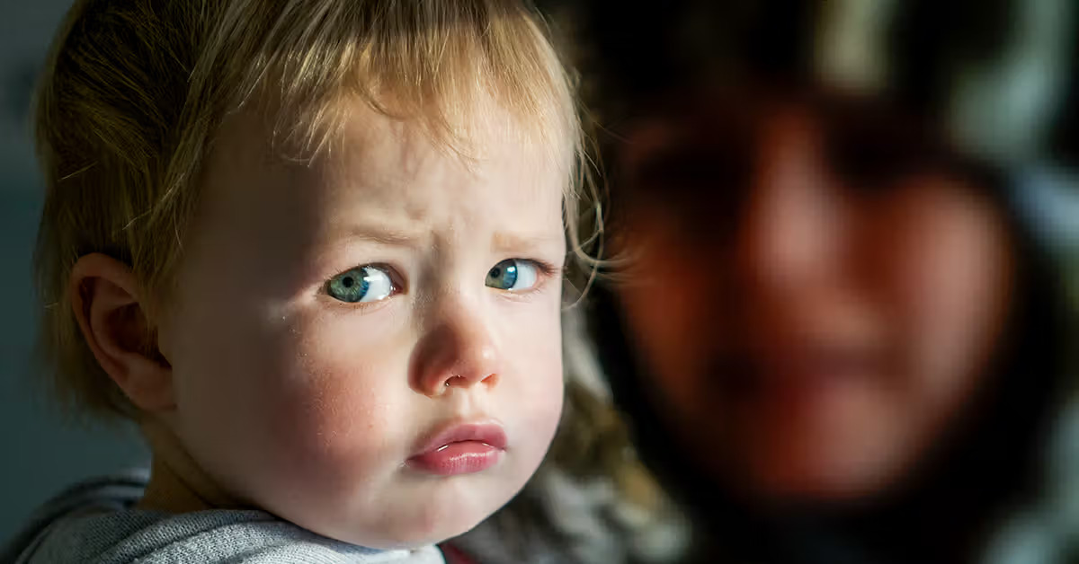 Young child showing signs of respiratory illness, demonstrating why understanding croup transmission is important